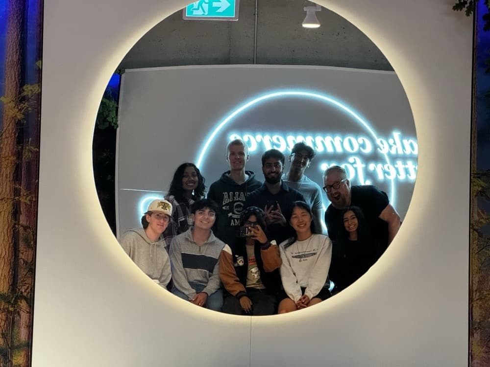 A group inside the lit ring at the Shopify office